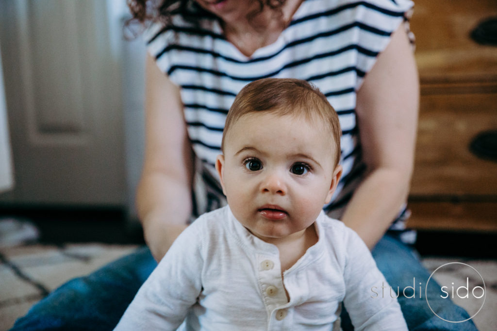 A baby boy sitting in front of his mama, Silver Lake, Los Angeles, CA