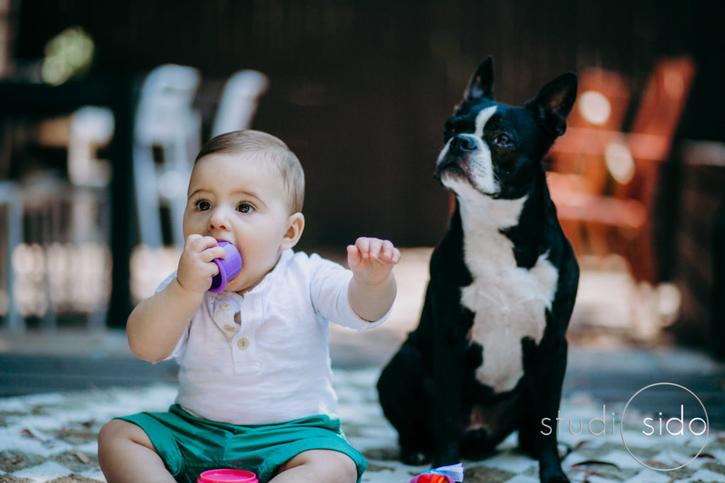 A baby boy and his dog sit outside in Silver Lake, Los Angeles, CA